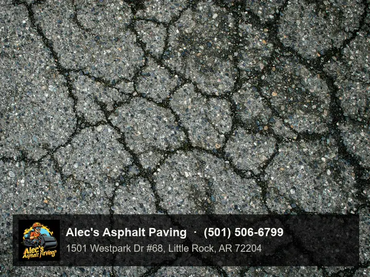 Close view of alligator cracking spreading across worn asphalt