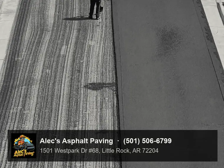 Looking down on a residential street mid-resurfacing: the left lane is the grooved, milled old surface streaked with tack coat, the right lane is fresh smooth black asphalt, with concrete curbs, sidewalks, and lawns on both sides