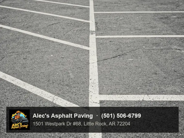 Crisp white parking stall lines on dark asphalt