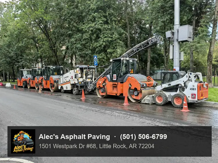 Milling machines and rollers resurfacing a tree-lined street